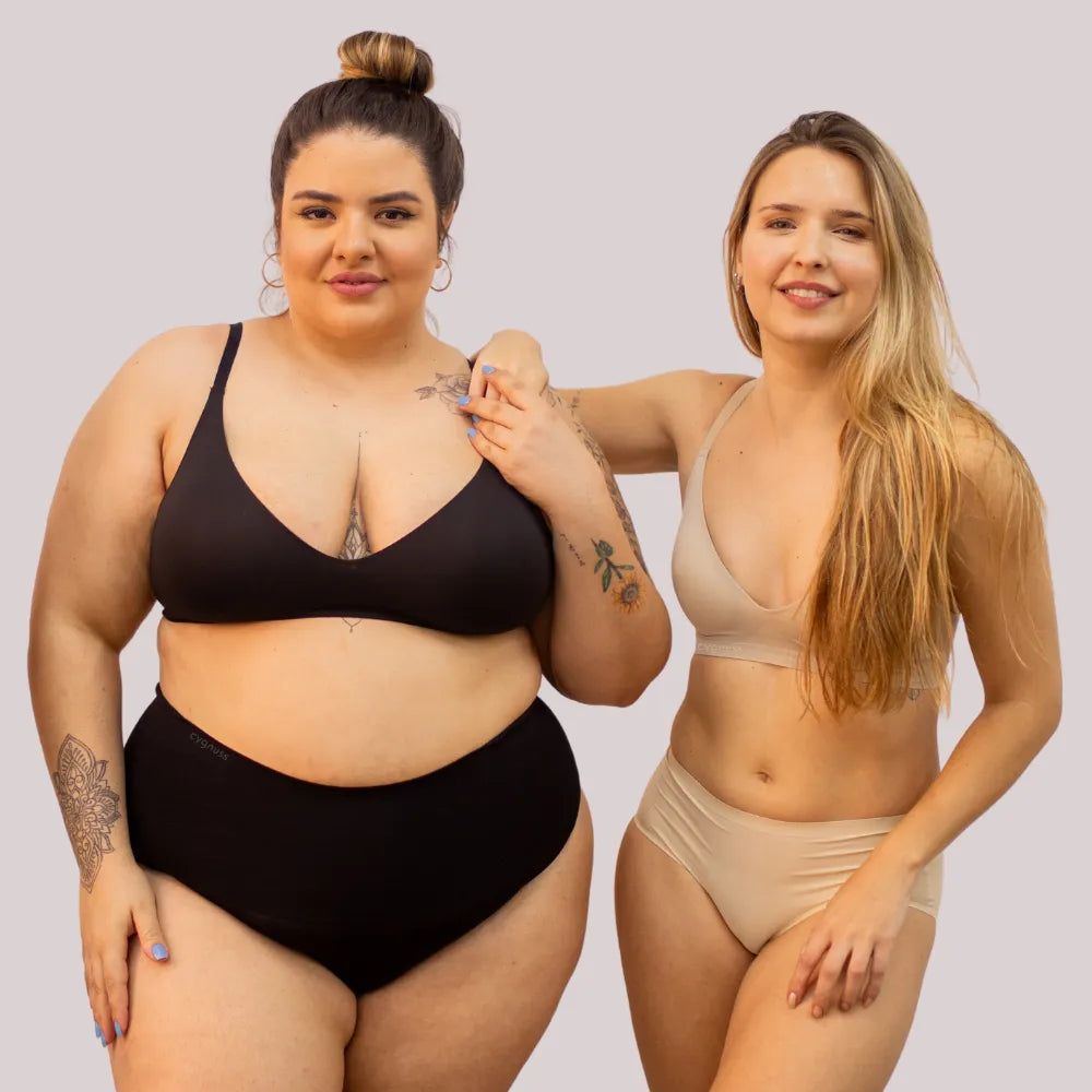 Duas mulheres vestindo o Sutiã Alça Fina Cygnuss, uma na cor preta e outra nude, representando a diversidade de corpos e ajuste perfeito.
