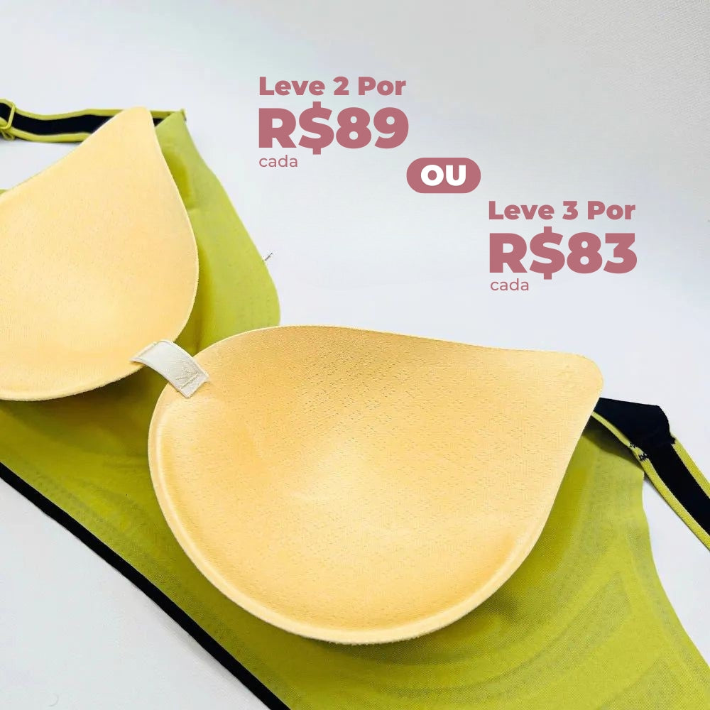 Imagem de um sutiã esportivo Cygnuss na cor verde com bojo removível destacado à frente. O sutiã possui alças com detalhes em preto e amarelo, oferecendo conforto e versatilidade. A imagem também exibe uma promoção destacada com preços diferenciados para compras em quantidade.