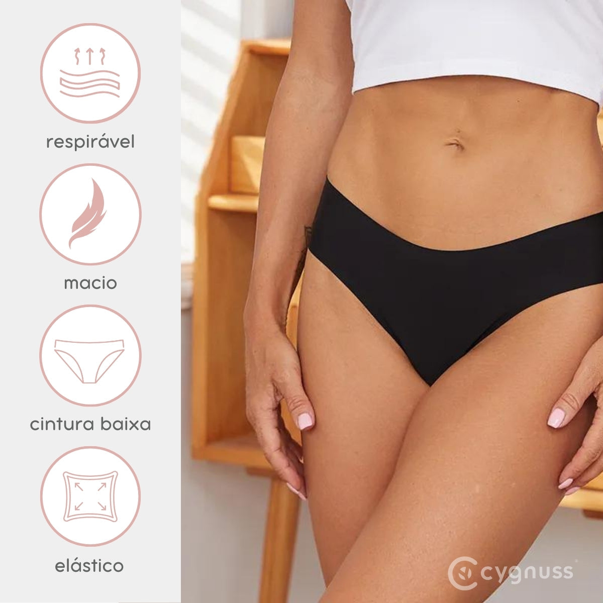 Close-up da região do quadril de uma mulher usando uma calcinha preta sem costura da Cygnuss. Ao lado, ícones destacam as características do produto: respirável, macio, cintura baixa e elástico