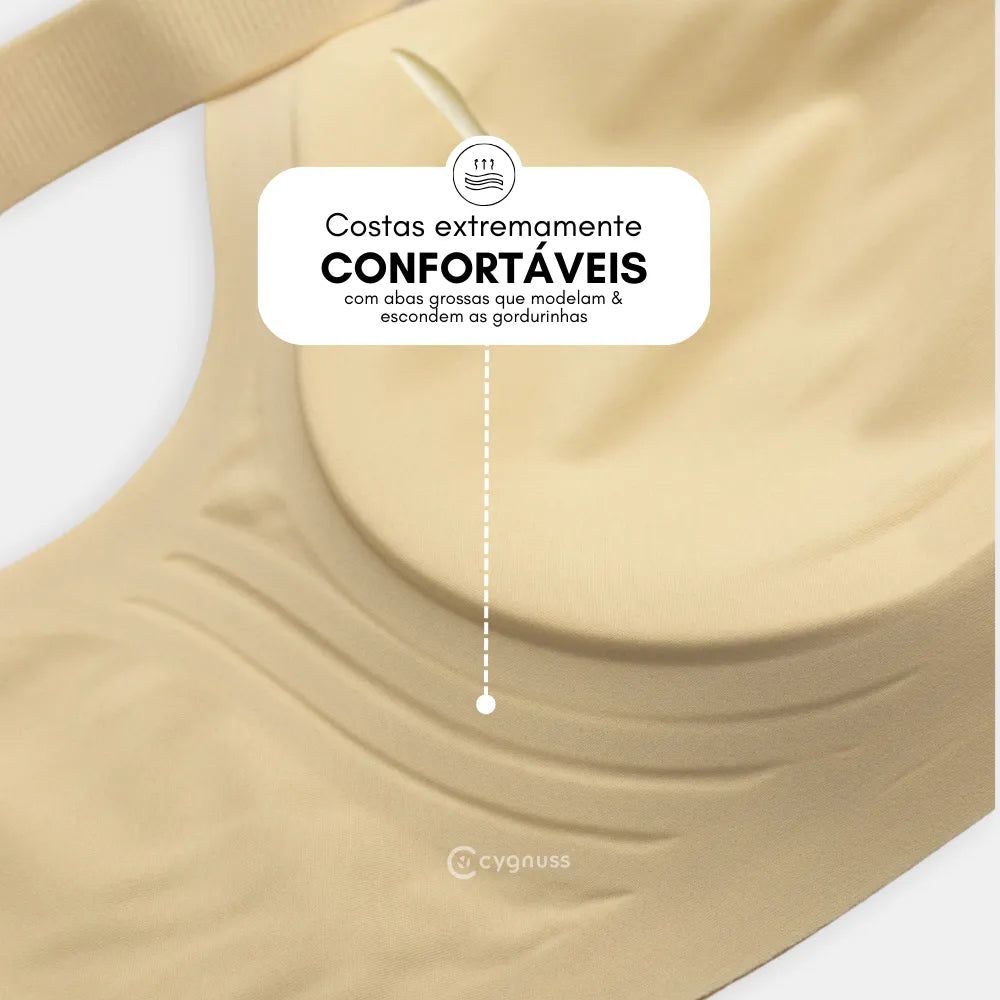 Close-up do Sutiã Dreams na cor nude, destacando a área das costas com abas largas e reforçadas. A imagem ressalta o conforto extremo proporcionado pelo design, que ajuda a modelar e disfarçar as gordurinhas. O logo da Cygnuss está visível na parte inferior do tecido.