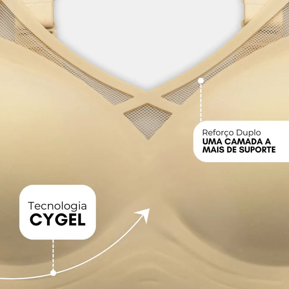 Close-up do Sutiã Dreams na cor nude, destacando seus diferenciais. A imagem aponta para a Tecnologia Cygel, que proporciona conforto e sustentação sem a necessidade de aro, e para o Reforço Duplo, que adiciona uma camada extra de suporte. O design inclui detalhes vazados em tule no decote para um toque sofisticado.