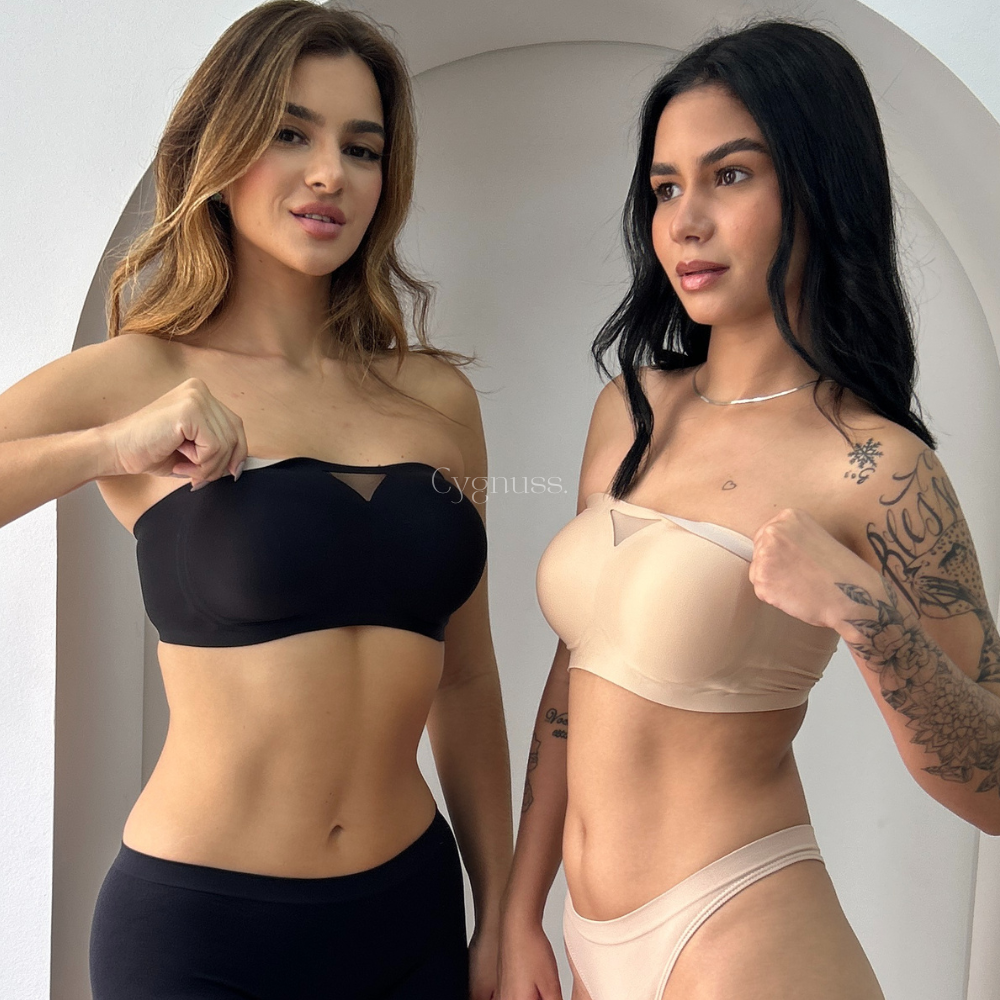 Duas modelos vestindo o Sutiã Tomara que Caia Sensação nas cores preto e bege, demonstrando a firmeza e sustentação da peça. O recorte triangular em tule no centro adiciona um toque sofisticado ao design