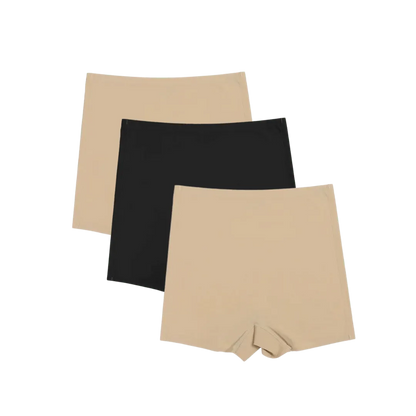 Conjunto de Shorts Segunda Pele disponível em três cores: bege, preto e branco. Design sem costura que garante conforto e suavidade, ideal para um ajuste perfeito sob qualquer roupa.