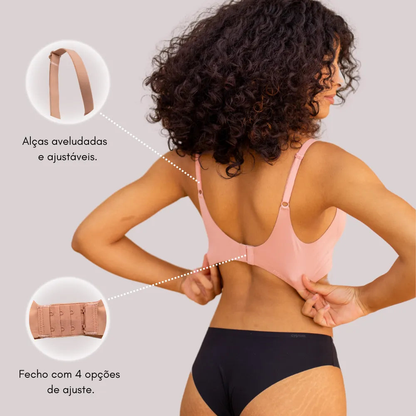 Mulher vestindo sutiã com alças ajustáveis e fechamento com 4 opções. Sutiã confortável, sem costura e invisível.