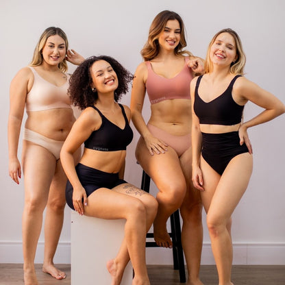 Imagem de quatro modelos usando o sutiã premium reforçado