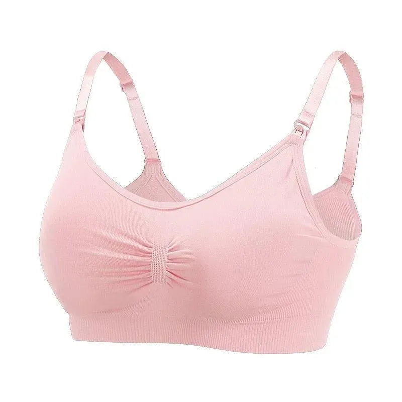 Sutiã Amamentação sem Bojo rosa claro da collab Cygnuss x Lupo, fotografado em fundo branco. A peça possui alças finas com clipes para abertura, detalhe franzido central no busto e modelagem anatômica com tecido canelado. Imagem do tipo still, ideal para exibição em loja virtual.